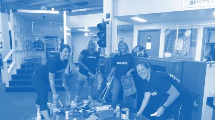 A group of volunteers smiling and posing for a photo.