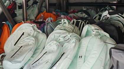 Backpacks loaded onto the bus