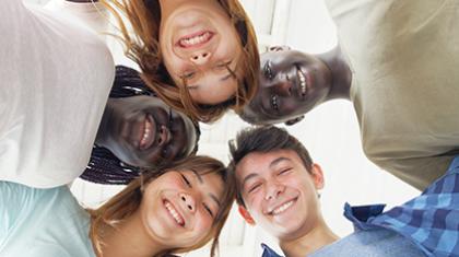 A group of teenagers in a circle